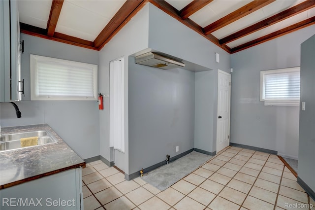 1925 Gilmartin St, Flint, MI 48503 - kitchen with a sink, baseboards, and light tile patterned flooring
