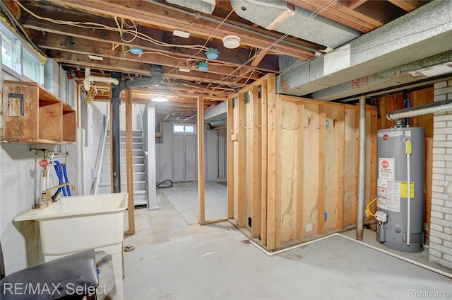 1925 Gilmartin St, Flint, MI 48503 - below grade area with water heater and a sink