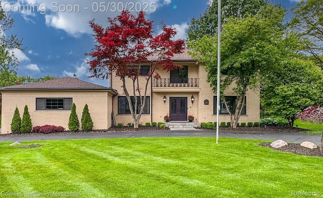 4462 Barchester Dr, Bloomfield Hills, MI 48302 - view of front of home featuring a balcony, a front lawn, and brick siding