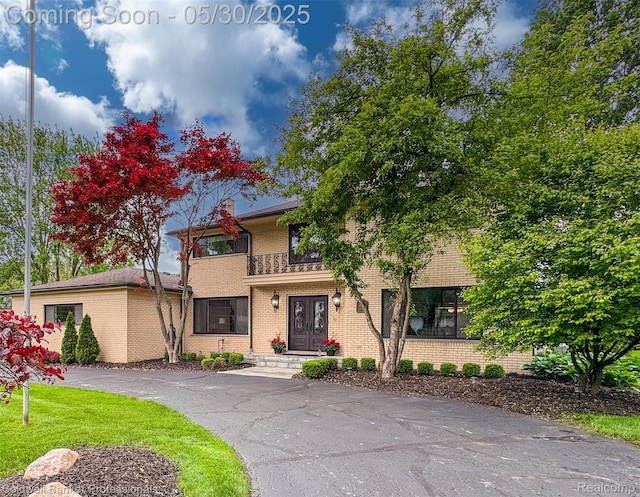 4462 Barchester Dr, Bloomfield Hills, MI 48302 - view of front of property featuring brick siding and a chimney