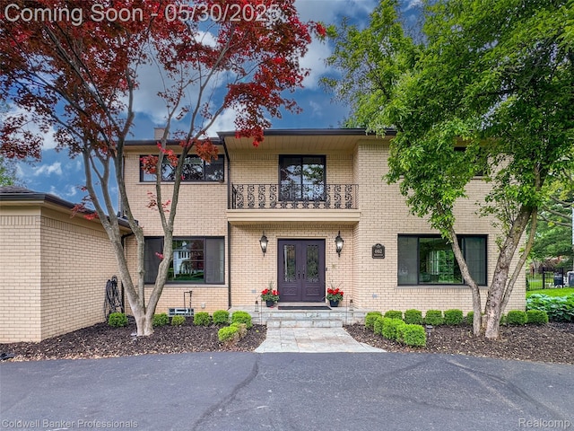 4462 Barchester Dr, Bloomfield Hills, MI 48302 - view of front of property featuring french doors, a balcony, and brick siding