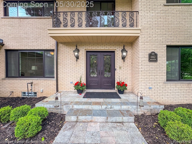 4462 Barchester Dr, Bloomfield Hills, MI 48302 - doorway to property with french doors, a balcony, and brick siding