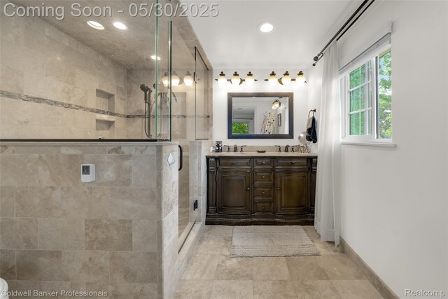 4462 Barchester Dr, Bloomfield Hills, MI 48302 - full bath with double vanity, a stall shower, recessed lighting, and baseboards