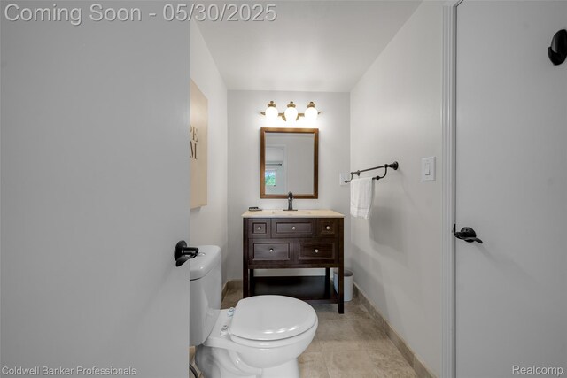 4462 Barchester Dr, Bloomfield Hills, MI 48302 - bathroom with toilet, vanity, baseboards, and tile patterned flooring