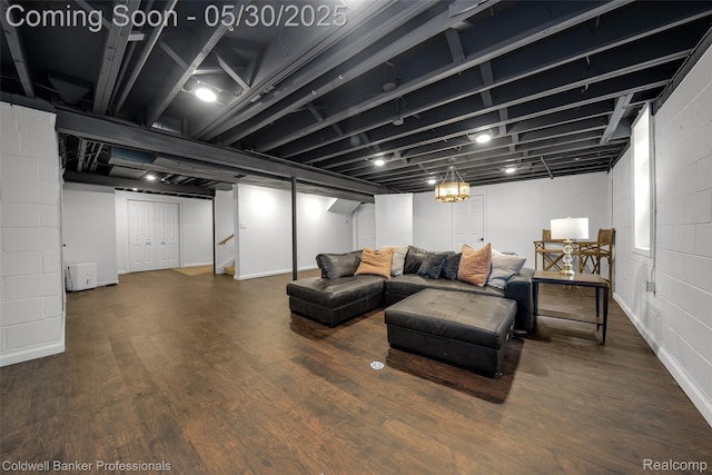 4462 Barchester Dr, Bloomfield Hills, MI 48302 - living area with wood finished floors, stairway, and concrete block wall
