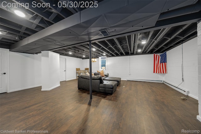 4462 Barchester Dr, Bloomfield Hills, MI 48302 - finished basement with a baseboard heating unit, wood finished floors, and baseboards