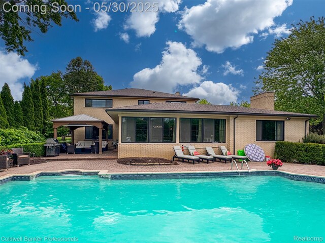 4462 Barchester Dr, Bloomfield Hills, MI 48302 - outdoor pool with outdoor lounge area, a gazebo, and a patio area
