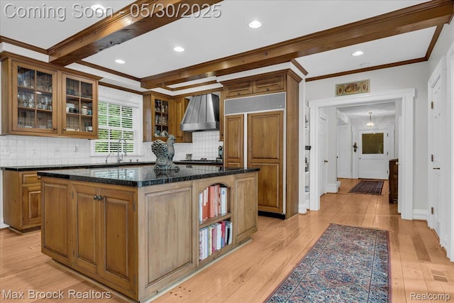 27160 Scenic, Franklin, MI 48025 - kitchen with paneled fridge, ornamental molding, wall chimney range hood, tasteful backsplash, and light wood-style flooring