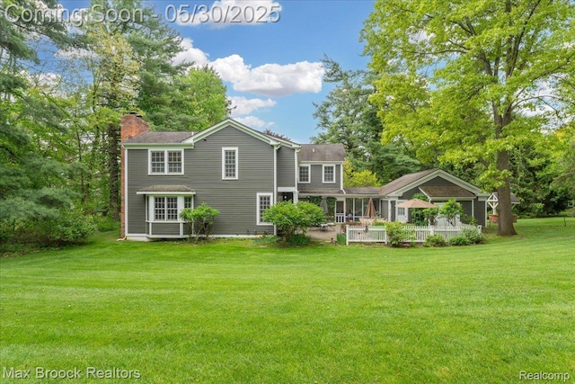 27160 Scenic, Franklin, MI 48025 - back of house featuring a chimney, a lawn, and a patio