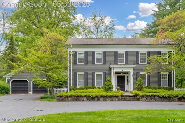 27160 Scenic, Franklin, MI 48025 - view of front of house with a garage, driveway, and an outbuilding