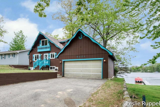 6221 Honeymoon Dr, Lakeview, MI 48850 - view of front of home with a garage and a water view