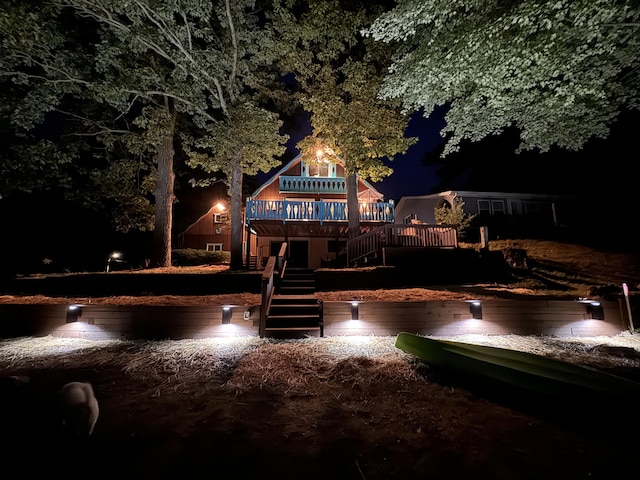 6221 Honeymoon Dr, Lakeview, MI 48850 - back of house at twilight featuring stairway and a deck