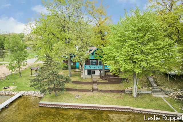 6221 Honeymoon Dr, Lakeview, MI 48850 - view of grassy yard featuring stairway and a deck