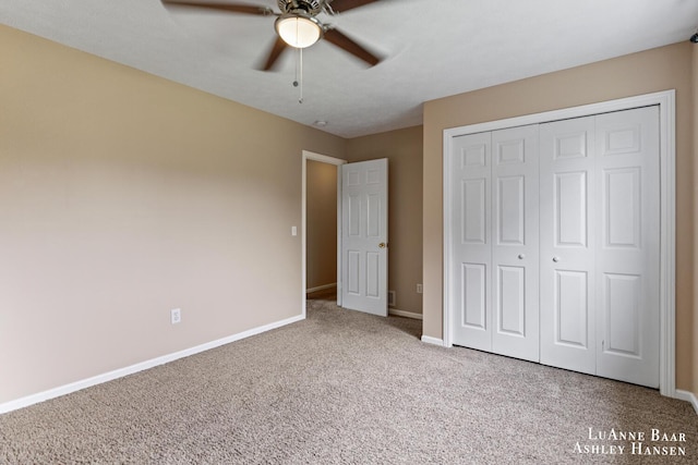 7300 Orchard View Dr NE, Rockford, MI 49341 - unfurnished bedroom featuring carpet floors, baseboards, a closet, and a ceiling fan
