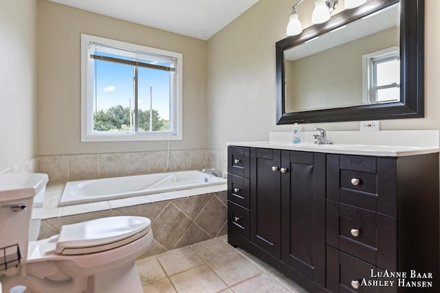 7300 Orchard View Dr NE, Rockford, MI 49341 - bathroom featuring a garden tub, tile patterned floors, toilet, and vanity