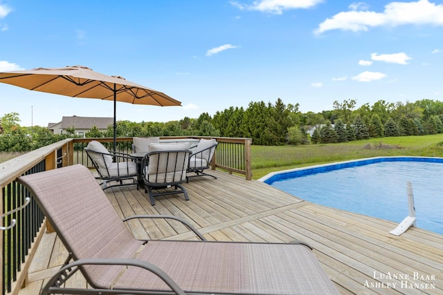7300 Orchard View Dr NE, Rockford, MI 49341 - outdoor pool with a wooden deck and outdoor dining space