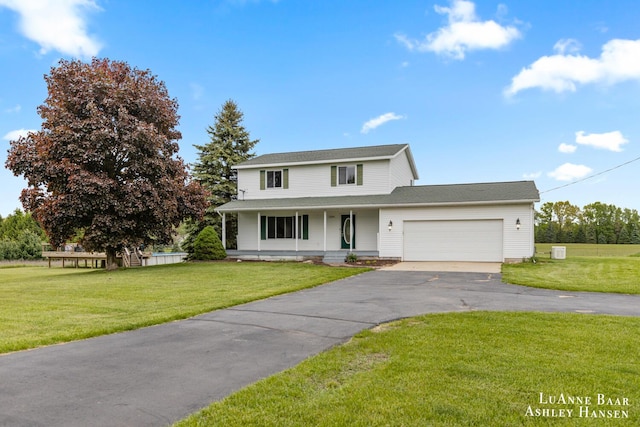 7300 Orchard View Dr NE, Rockford, MI 49341 - traditional home featuring covered porch, driveway, a front yard, and a garage