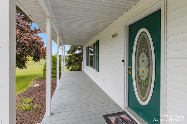 7300 Orchard View Dr NE, Rockford, MI 49341 - wooden porch with a lawn