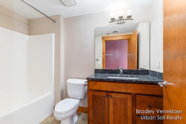 600 Broadway Ave NW Unit 414, Grand Rapids, MI 49504 - full bath featuring toilet, vanity, tile patterned flooring, and washtub / shower combination