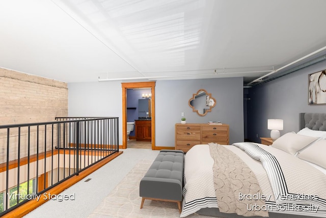 600 Broadway Ave NW Unit 414, Grand Rapids, MI 49504 - carpeted bedroom featuring connected bathroom