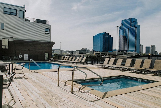 600 Broadway Ave NW Unit 414, Grand Rapids, MI 49504 - community pool featuring a deck, a city view, and a patio area