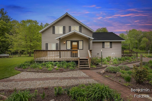 5826 W 124th St, Grant, MI 49327 - traditional-style house featuring a deck and a lawn