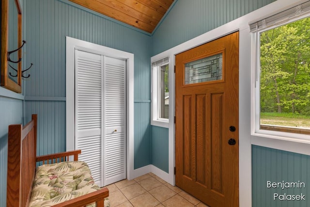5826 W 124th St, Grant, MI 49327 - entryway with light tile patterned floors, lofted ceiling, healthy amount of natural light, and wood ceiling