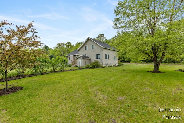 5826 W 124th St, Grant, MI 49327 - view of home's exterior featuring a yard