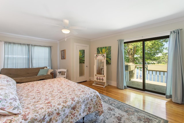 18957 N Fruitport Rd, Spring Lake, MI 49456 - bedroom with access to exterior, wood finished floors, crown molding, a ceiling fan, and baseboards