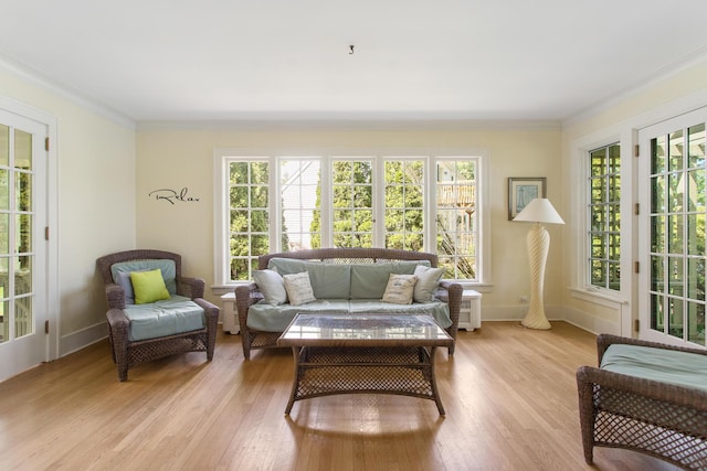 18957 N Fruitport Rd, Spring Lake, MI 49456 - living area featuring light wood finished floors, ornamental molding, and baseboards