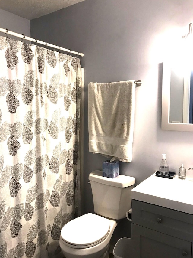 5883 Thistlewood Ave, Scotts, MI 49088 - full bath featuring toilet, vanity, and a shower with shower curtain