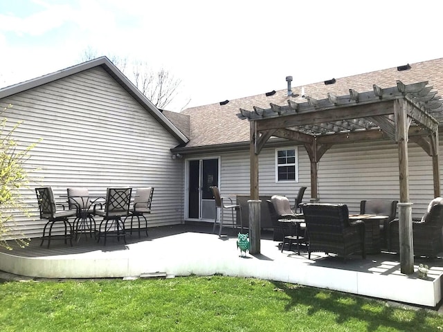 5883 Thistlewood Ave, Scotts, MI 49088 - back of house with a pergola, a deck, roof with shingles, outdoor dining space, and a yard
