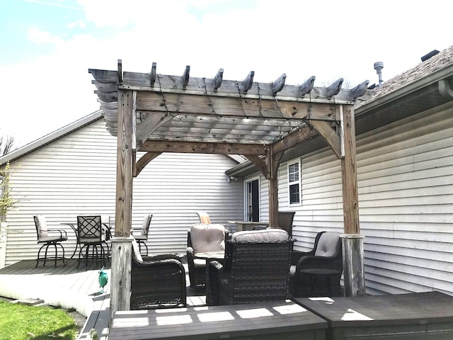 5883 Thistlewood Ave, Scotts, MI 49088 - view of patio / terrace featuring a wooden deck, a pergola, and outdoor dining area