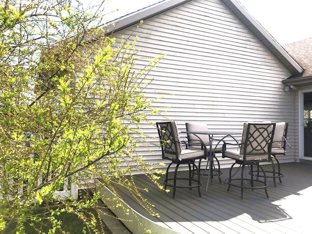 5883 Thistlewood Ave, Scotts, MI 49088 - wooden deck with outdoor dining area