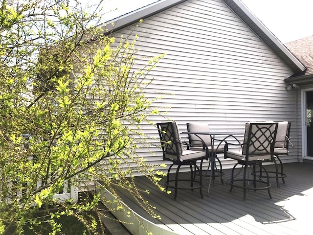 5883 Thistlewood Ave, Scotts, MI 49088 - wooden terrace with outdoor dining area