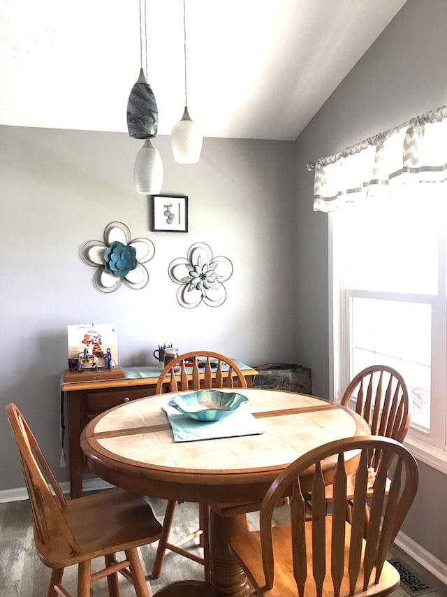 5883 Thistlewood Ave, Scotts, MI 49088 - dining area with baseboards and vaulted ceiling