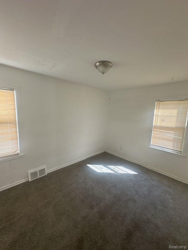 18932 Riverview St, Detroit, MI 48219 - unfurnished room featuring dark carpet and baseboards