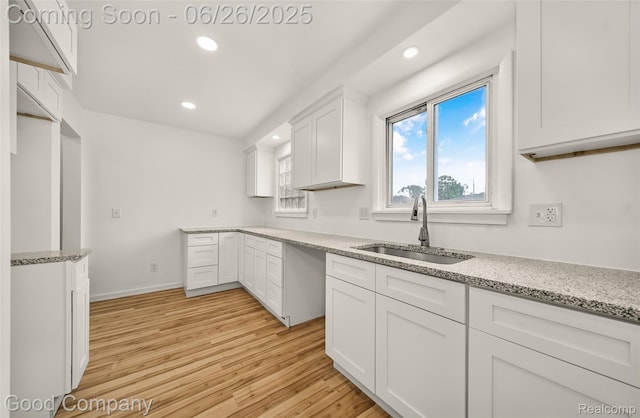 26730 W Davison, Redford, MI 48239 - kitchen with light wood-type flooring, light stone countertops, recessed lighting, and white cabinetry