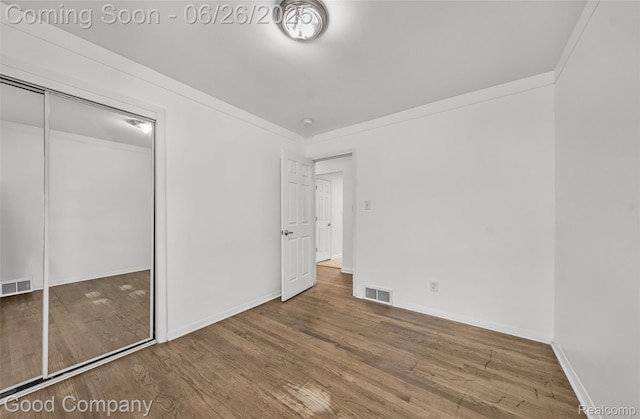 26730 W Davison, Redford, MI 48239 - unfurnished bedroom with wood finished floors, a closet, and ornamental molding