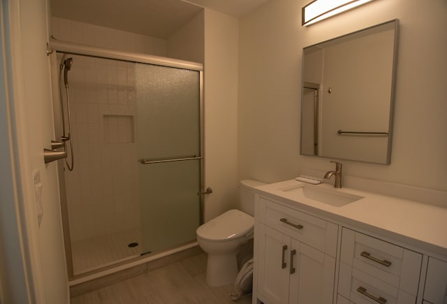 20072 Rodeo, Southfield, MI 48075 - full bathroom featuring toilet, a stall shower, vanity, and wood finished floors