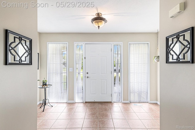 1411 Vollar Dr, Flint, MI 48532 - foyer featuring baseboards and light tile patterned floors