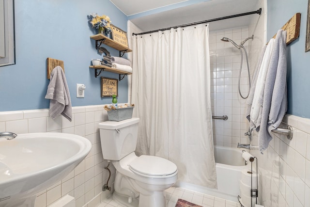 1977 Shipman Rd, Oxford, MI 48371 - full bath with tile walls, a sink, toilet, shower / tub combo with curtain, and wainscoting