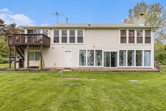 1977 Shipman Rd, Oxford, MI 48371 - rear view of property with a chimney, a wooden deck, and a yard