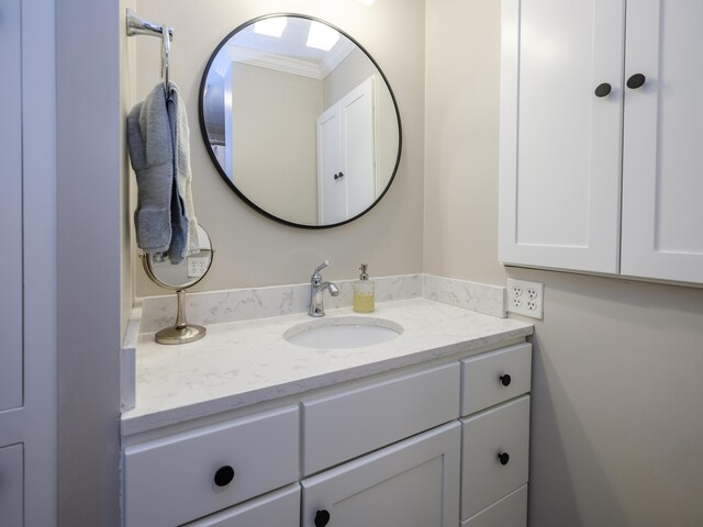 471 W S St Unit 207, Kalamazoo, MI 49007 - bathroom featuring vanity and ornamental molding