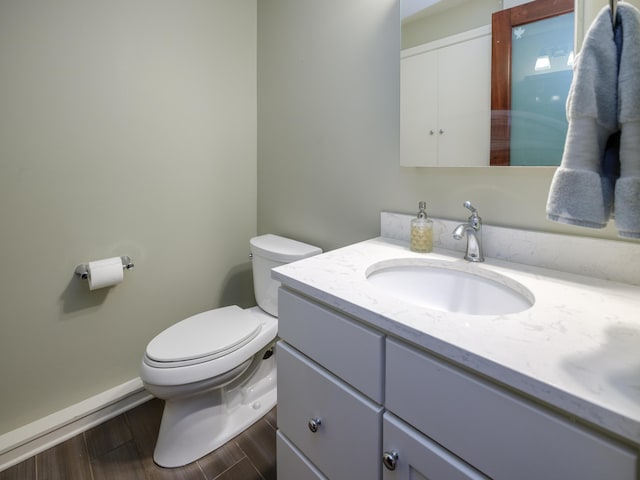 471 W S St Unit 207, Kalamazoo, MI 49007 - half bath featuring toilet, wood finished floors, vanity, and baseboards