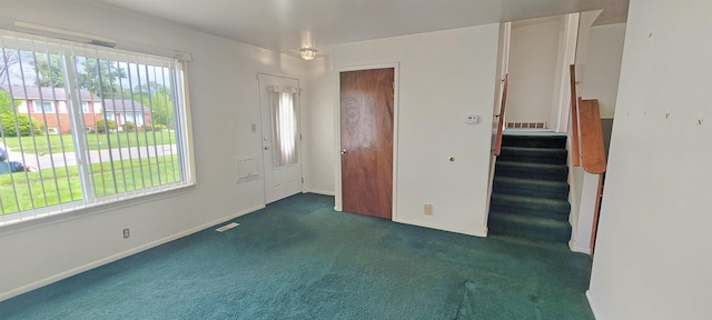 6121 Eldon Rd, Mount Morris, MI 48458 - entryway with carpet flooring, stairs, and baseboards