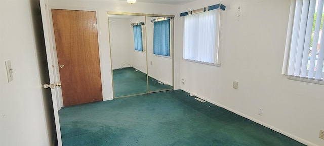 6121 Eldon Rd, Mount Morris, MI 48458 - spare room featuring carpet and baseboards