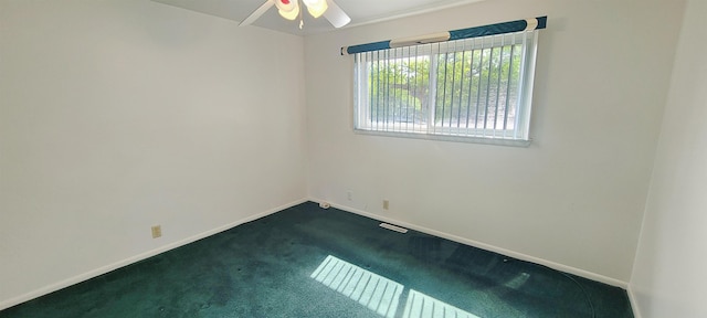 6121 Eldon Rd, Mount Morris, MI 48458 - unfurnished room featuring dark carpet, a ceiling fan, and baseboards
