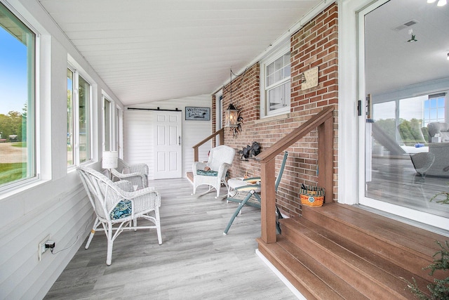 7394 N Keating Dr, Walkerville, MI 49459 - sunroom featuring plenty of natural light, wood finished floors, and lofted ceiling