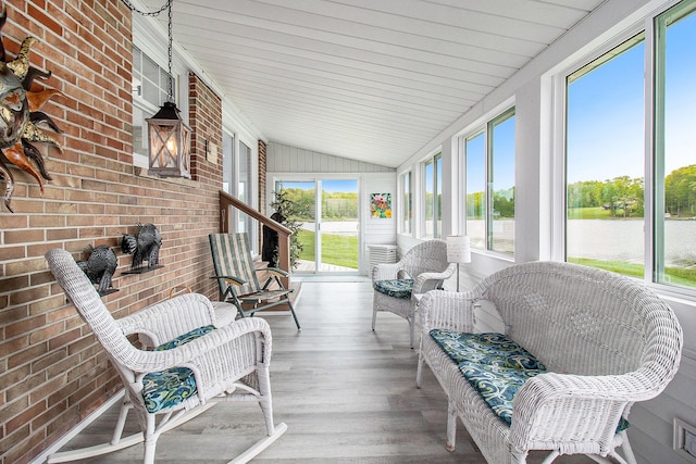 7394 N Keating Dr, Walkerville, MI 49459 - sunroom with vaulted ceiling and a water view